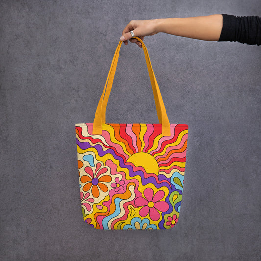 Vibrant 1970s psychedelic tote bag featuring a wavy retro sunburst sunset surrounded by colorful groovy flowers.