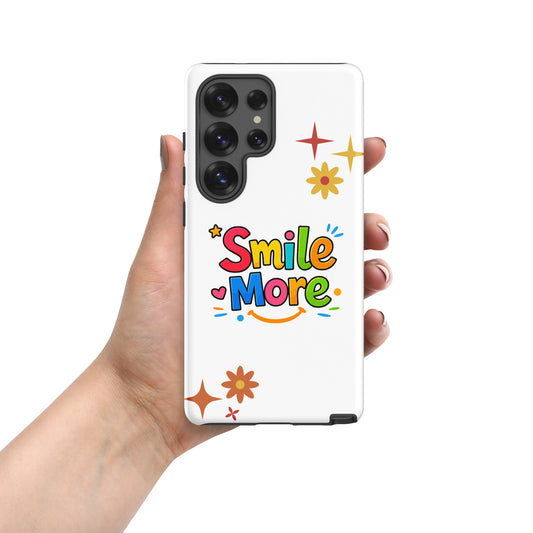 Smile More, bubbly lettering with a yellow sun-smile and pink heart on a black Samsung Galaxy phone case.
