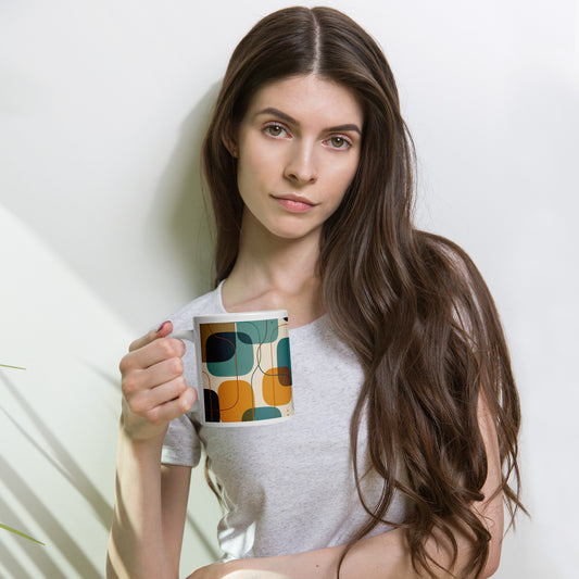 Retro geometric ceramic coffee mug featuring mid-century rounded squares and lines in teal, mustard yellow, and orange.