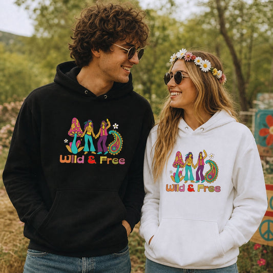 Front view of a cream unisex hoodie featuring a retro 1960s-style "Wild and Free" graphic with colorful vintage flowers.