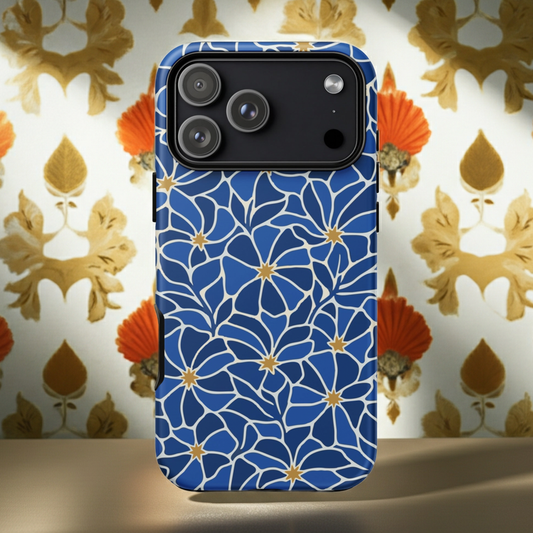 Vibrant blue mosaic floral pattern iPhone case with navy petals and gold star centers by Far Out Goods.
