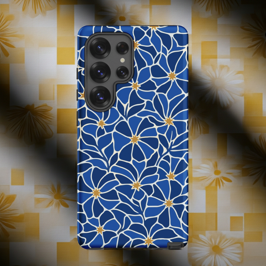 Vibrant blue mosaic floral pattern Samsung case with navy petals and gold star centers by Far Out Goods.