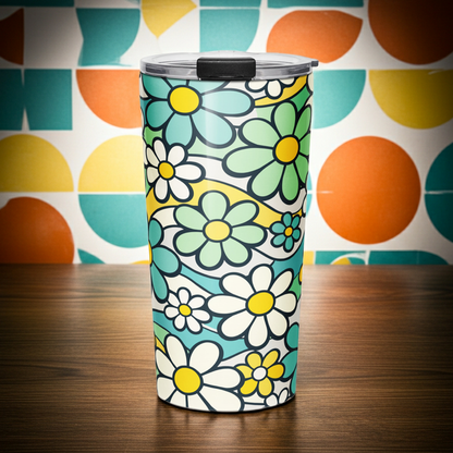 Insulated travel tumbler with a seamless 70s retro floral pattern featuring teal and yellow daisies and wavy lines.