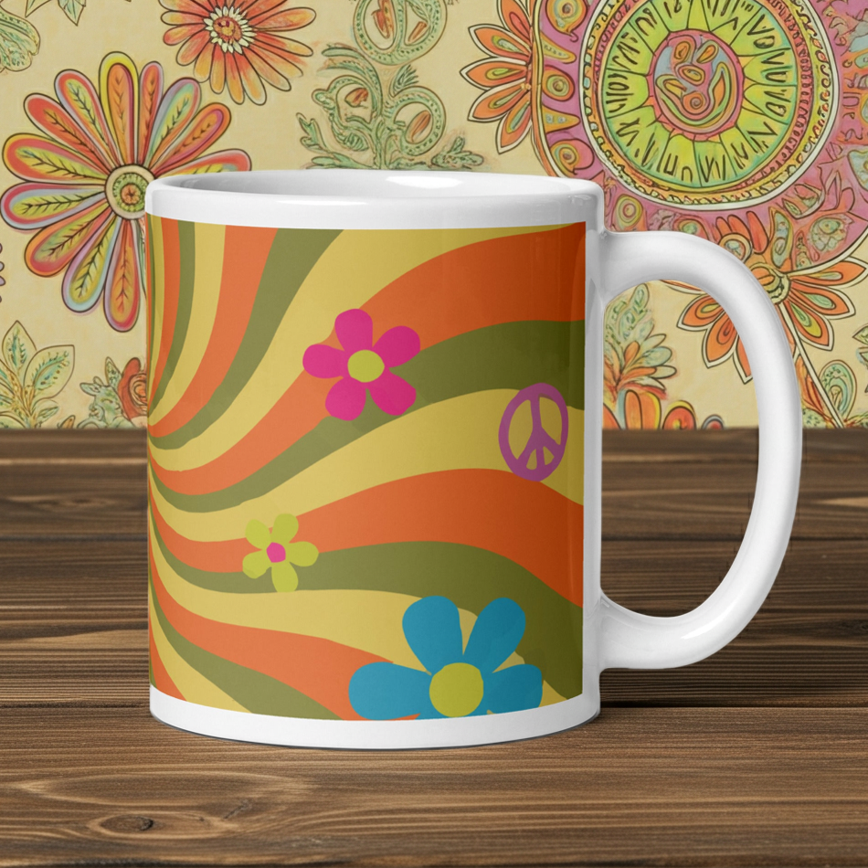 White glossy ceramic coffee mug featuring a bold 70s psychedelic swirl pattern with vibrant waves of orange, yellow, and hot pink wrapping around the cup.
