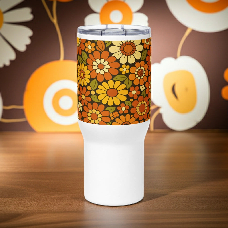 Retro 70s floral pattern stainless steel travel mug with orange, yellow, and cream daisies on a dark brown background.