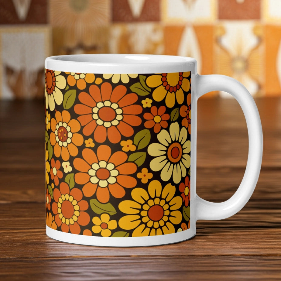 Retro 70s floral pattern ceramic mug featuring orange, yellow, and cream daisies on a dark brown background.