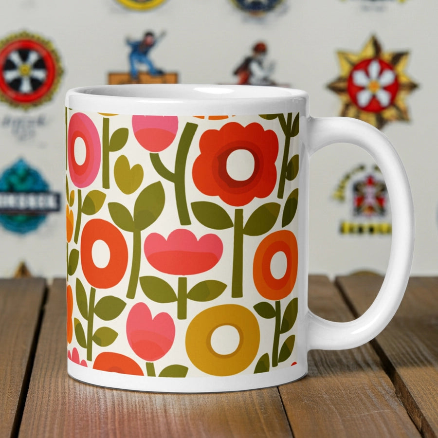 Retro 1970s flower power pattern ceramic mug featuring geometric orange, pink, and yellow flowers with green leaves