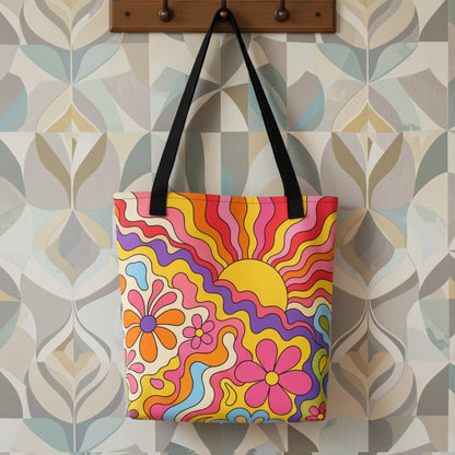 Vibrant 1970s psychedelic tote bag featuring a wavy retro sunburst sunset surrounded by colorful groovy flowers.
