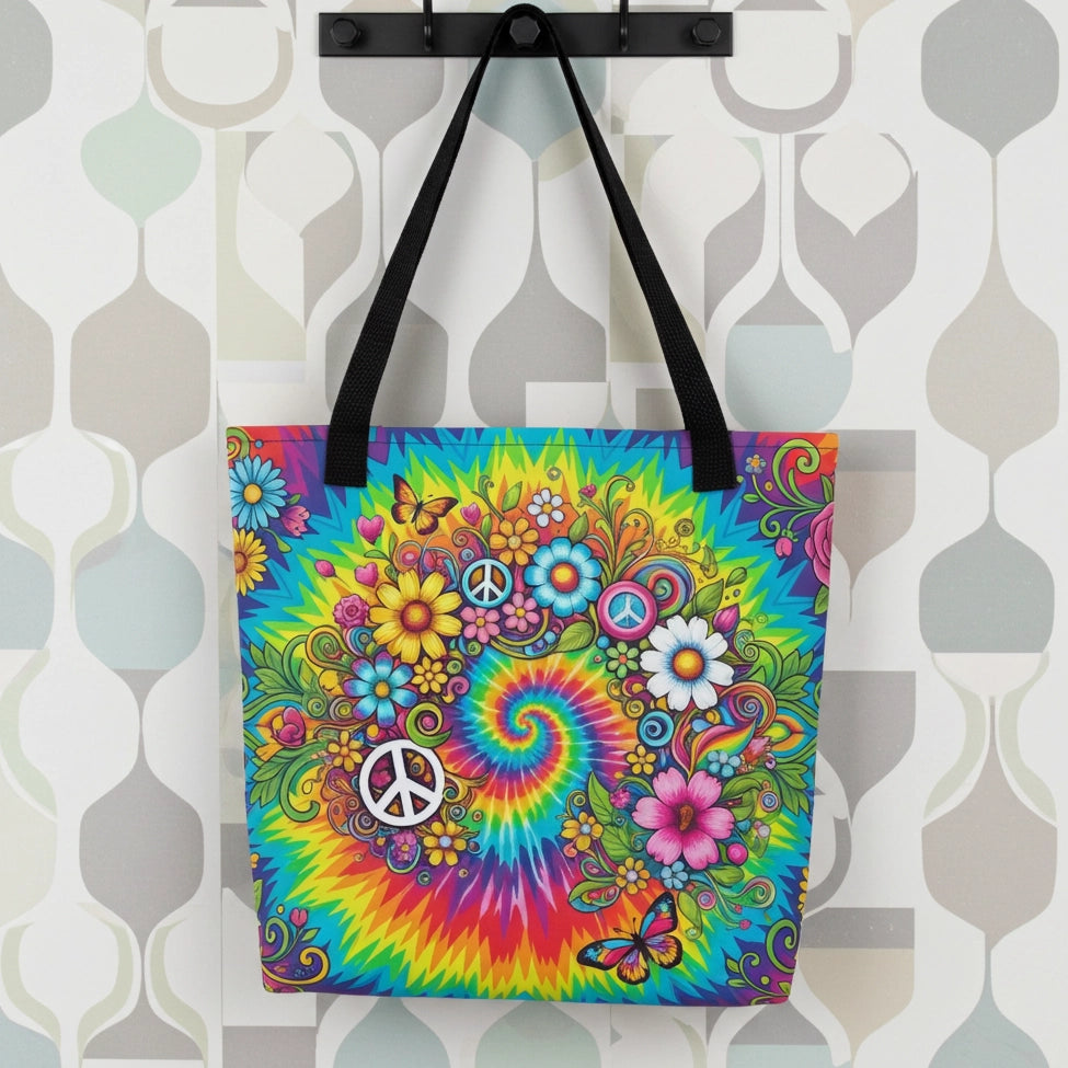 Vibrant psychedelic tie dye polyester tote bag featuring retro floral designs, butterflies, and white peace signs.