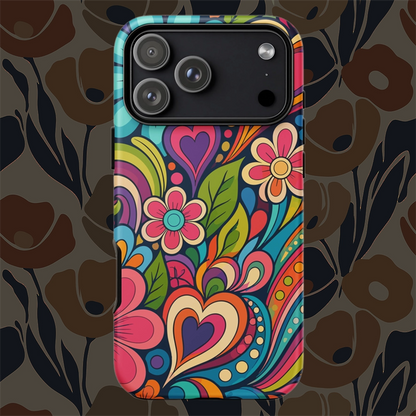 Vibrant retro psychedelic flower power design with colorful hearts, swirls, and daisies on a protective TPU iPhone case.