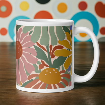 Retro 70s style flower power pattern with pink, green, and orange daisies on a bohemian ceramic coffee mug.