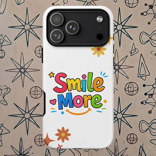 Smile More, bubbly lettering with a yellow sun-smile and pink heart on a black protective iPhone case