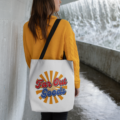 Retro orange sunburst design with Far Out Goods text in red and blue script on a black cotton tote bag.