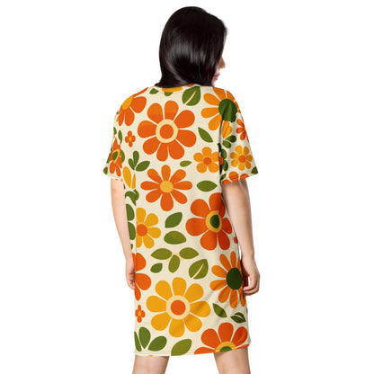 Vintage 70s retro flower power pattern with orange, yellow, and green daisy motifs printed on a comfy T-shirt dress.