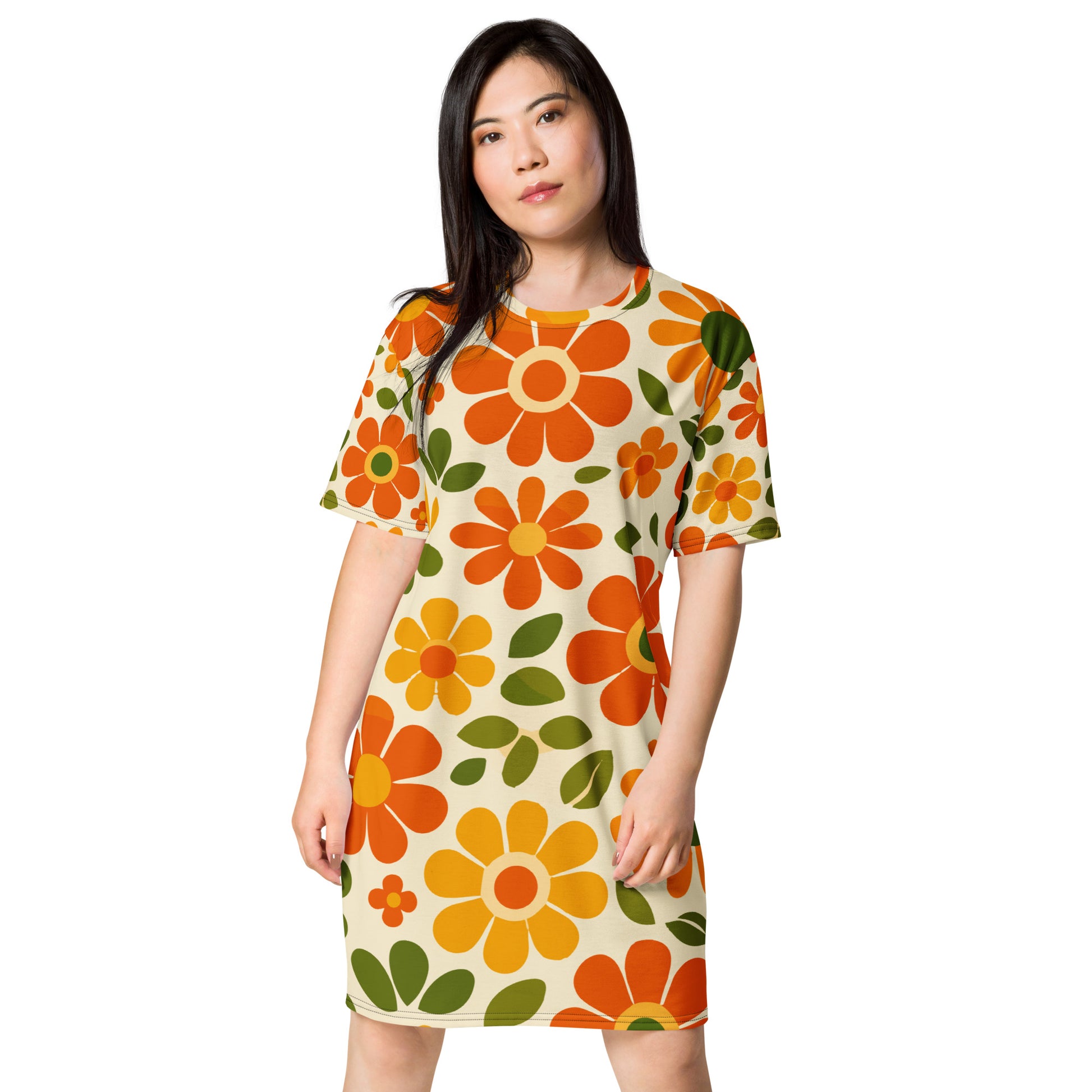 Vintage 70s retro flower power pattern with orange, yellow, and green daisy motifs printed on a comfy T-shirt dress.