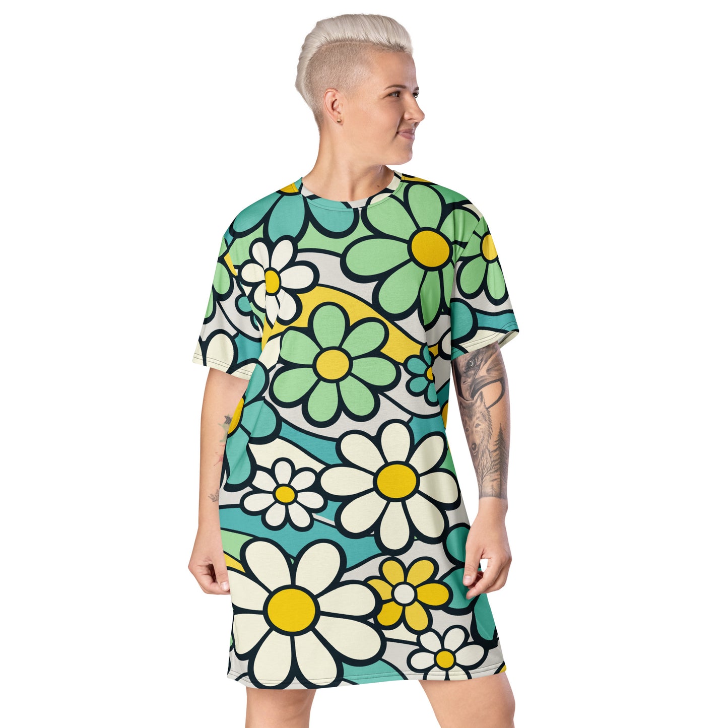 Retro 70s style t-shirt dress featuring a vibrant pattern of blue, yellow, and green flowers with wavy lines