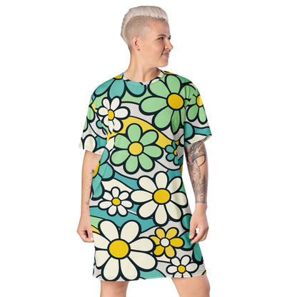 Retro 70s style t-shirt dress featuring a vibrant pattern of blue, yellow, and green flowers with wavy lines