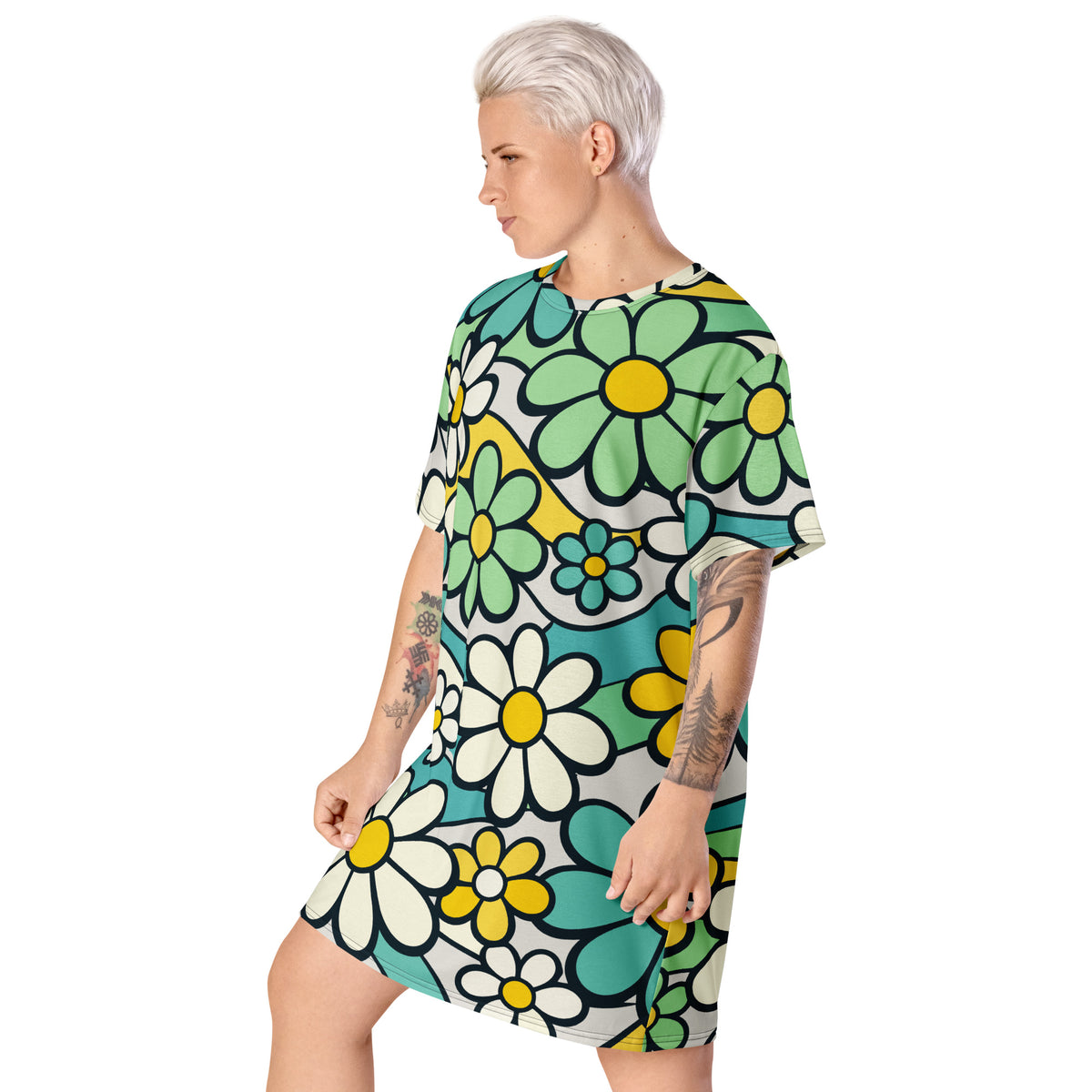 Retro 70s style t-shirt dress featuring a vibrant pattern of blue, yellow, and green flowers with wavy lines