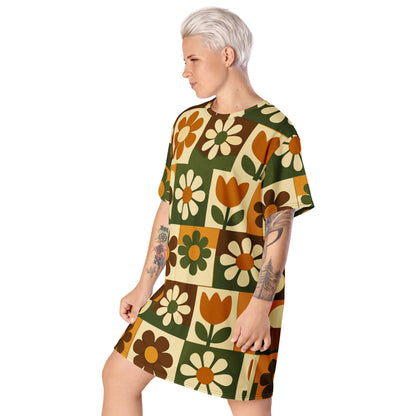 Retro 1970s mod floral tile pattern in orange, green, and brown on a casual t-shirt dress.