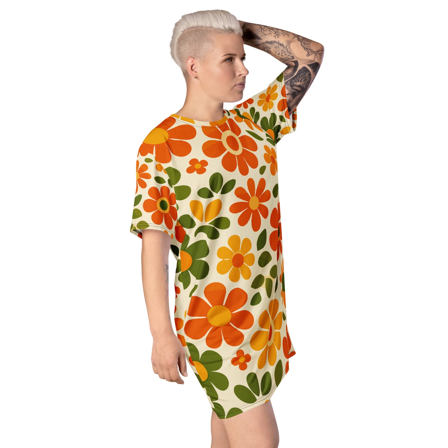 Vintage 70s retro flower power pattern with orange, yellow, and green daisy motifs printed on a comfy T-shirt dress.