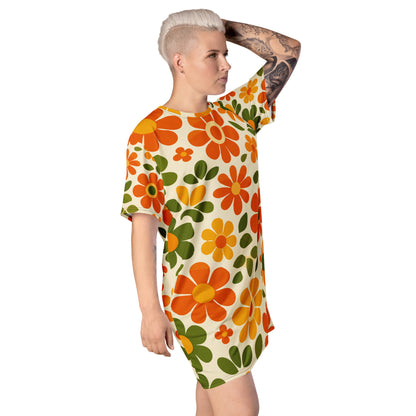 Vintage 70s retro flower power pattern with orange, yellow, and green daisy motifs printed on a comfy T-shirt dress.