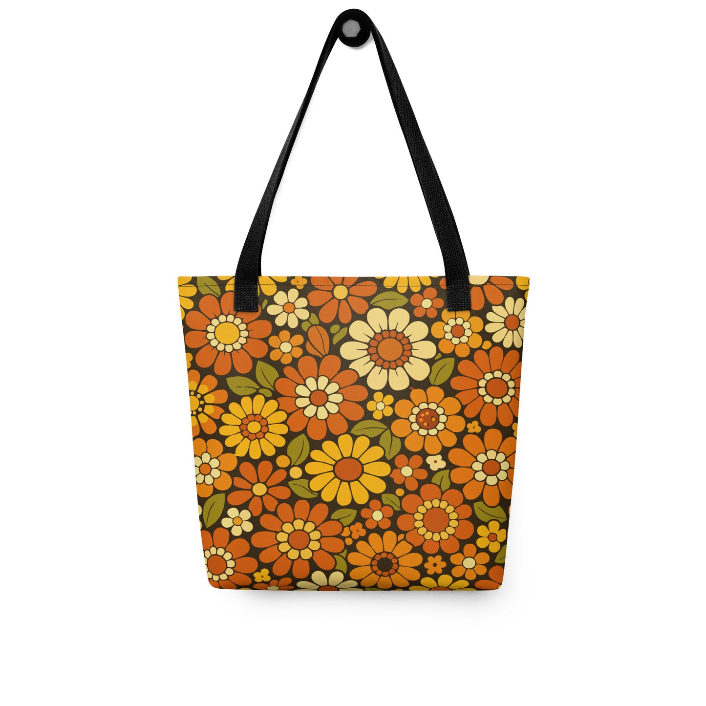 Retro 70s floral pattern polyester tote bag with orange, yellow, and cream daisies on a dark brown background.
