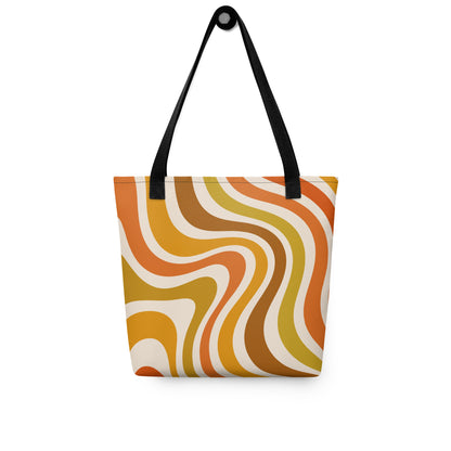 Retro 70s groovy wavy pattern in orange, mustard, brown, and cream printed on a durable polyester shoulder tote bag.