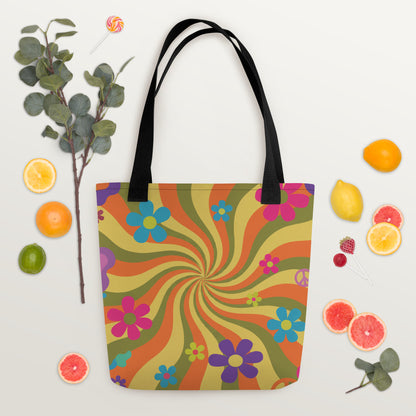 Durable canvas tote bag with an all-over retro 70s psychedelic swirl pattern in high-contrast orange, hot pink, and sunny yellow waves.