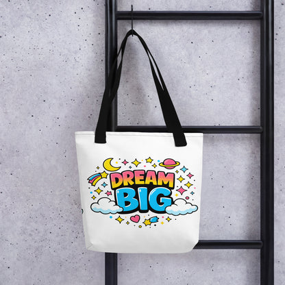 Colorful "Dream Big" text with stars, planets, and clouds in a retro 70s style on a black background tote bag.