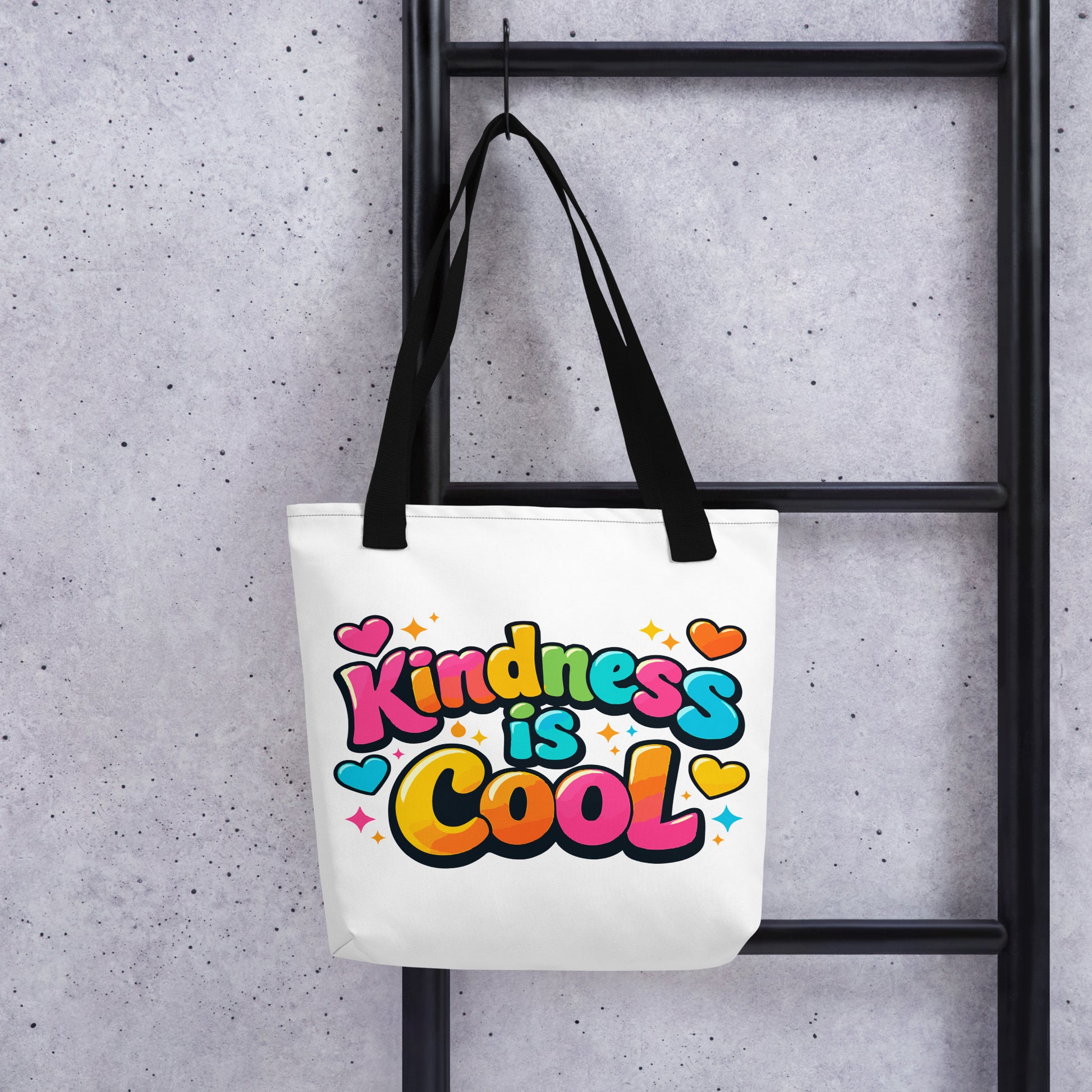Vibrant 3D bubble lettering saying Kindness is Cool with colorful hearts and stars on a black background for a tote bag.