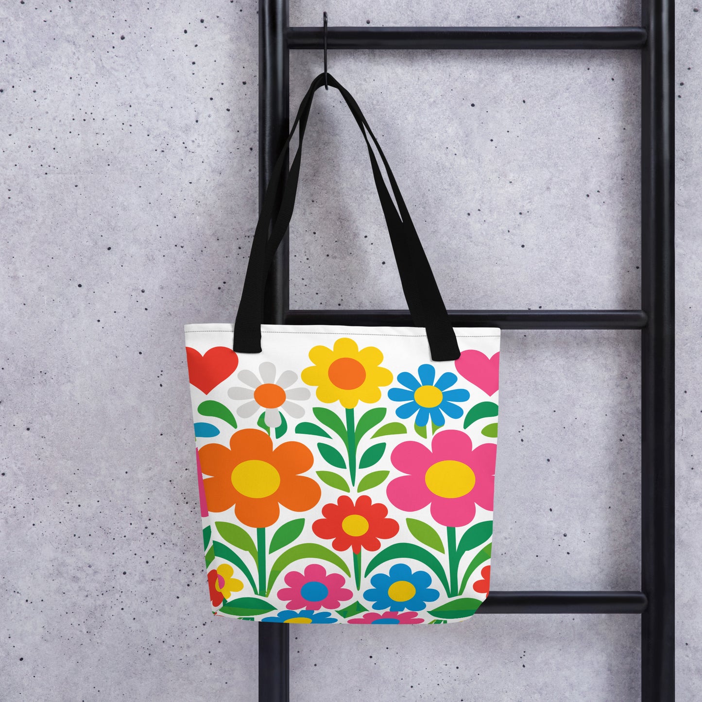 Vibrant 70s style retro flower power design with colorful daisies and hearts printed on a white tote bag. faroutgoods.