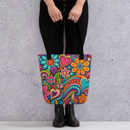 Polyester tote bag featuring a colorful 70s psychedelic doodle pattern of groovy flowers, retro swirls, and hearts.