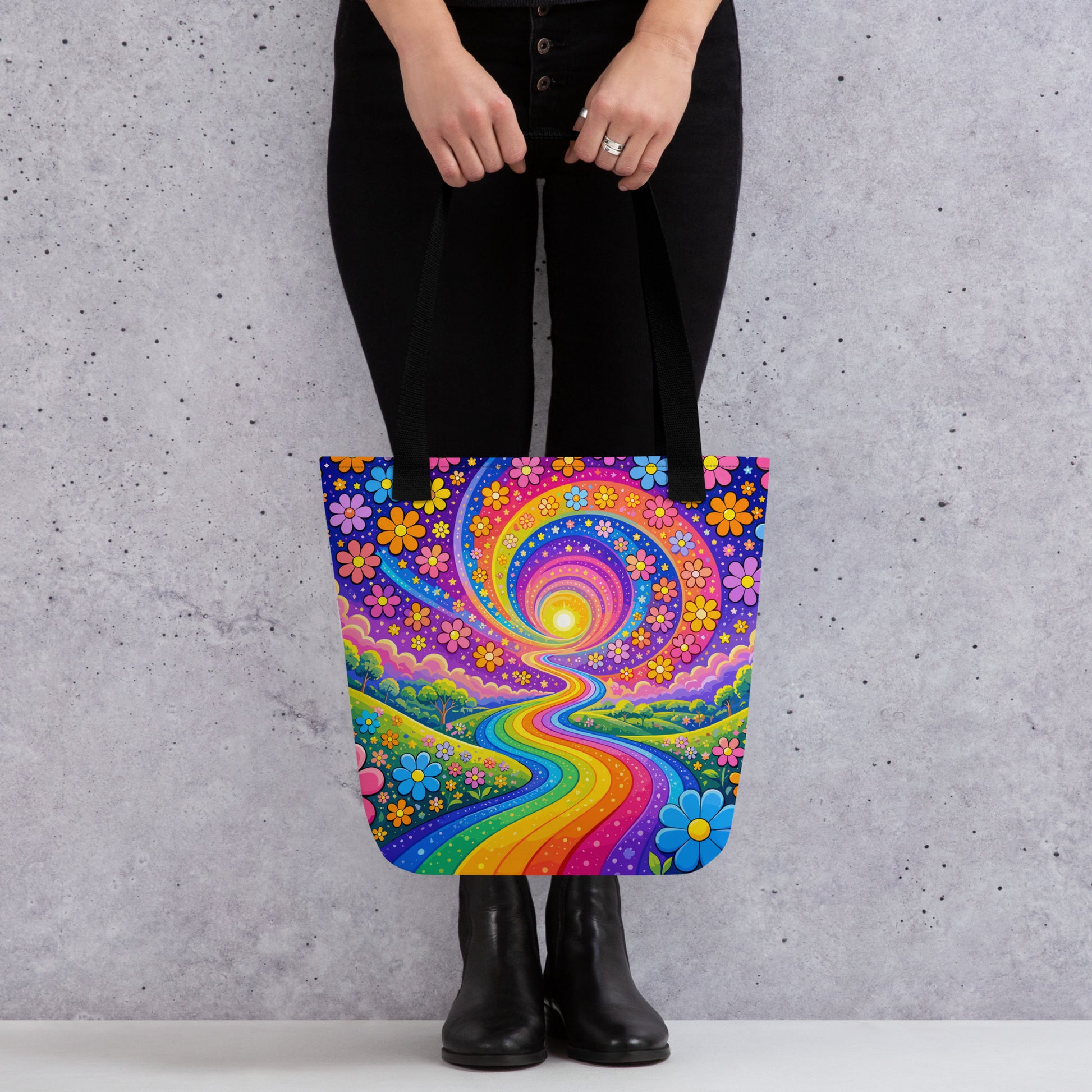 Psychedelic tote bag featuring a vibrant rainbow road winding through green hills with colorful daisy flowers