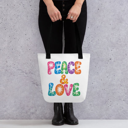 Retro tie-dye Peace and Love lettering printed on a reusable black polyester tote bag with vibrant 60s rainbow font.