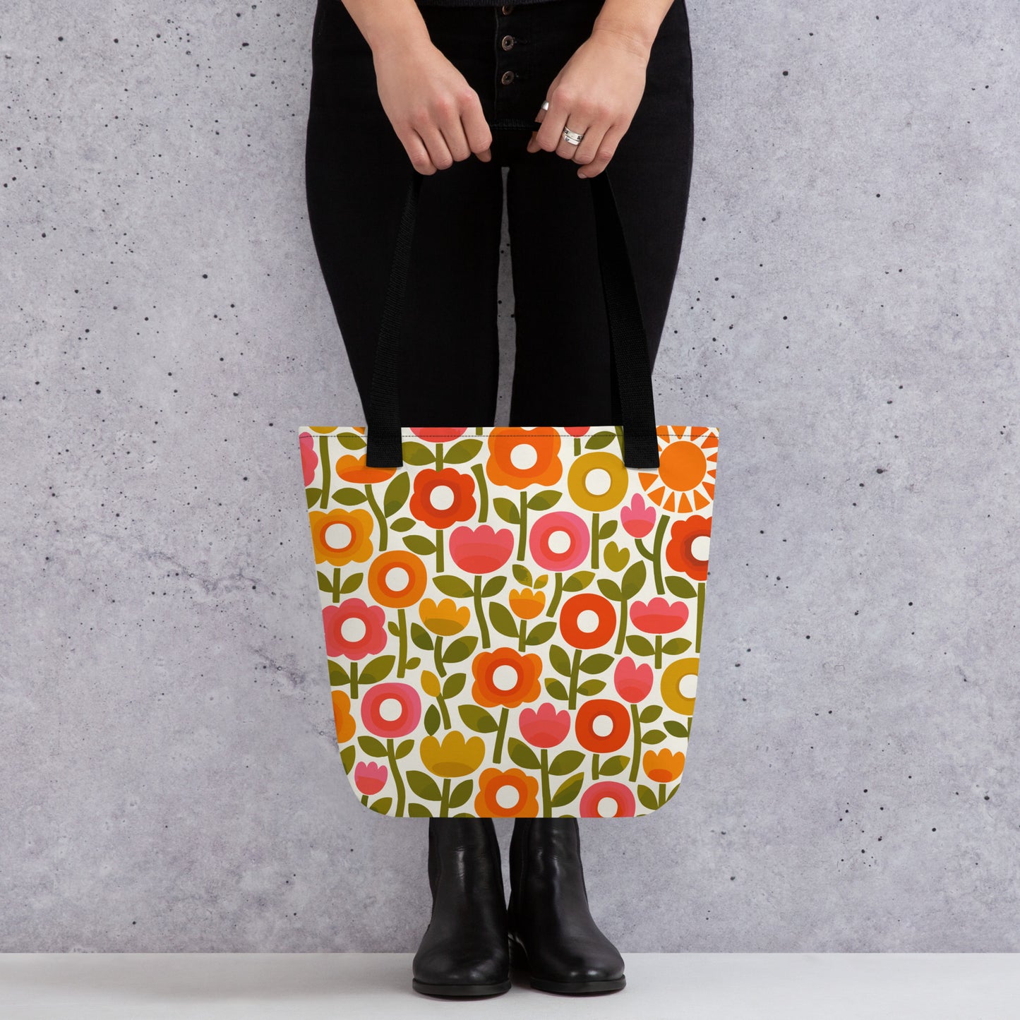 Retro 1970s flower power pattern tote bag featuring geometric orange, pink, and yellow flowers with green leaves