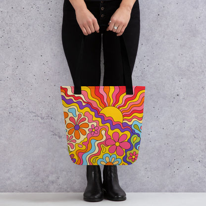 Vibrant 1970s psychedelic tote bag featuring a wavy retro sunburst sunset surrounded by colorful groovy flowers.