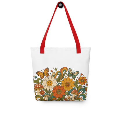 Retro 70s psychedelic tote bag featuring smiley daisies, red spotted mushrooms, and colorful butterflies on black.
