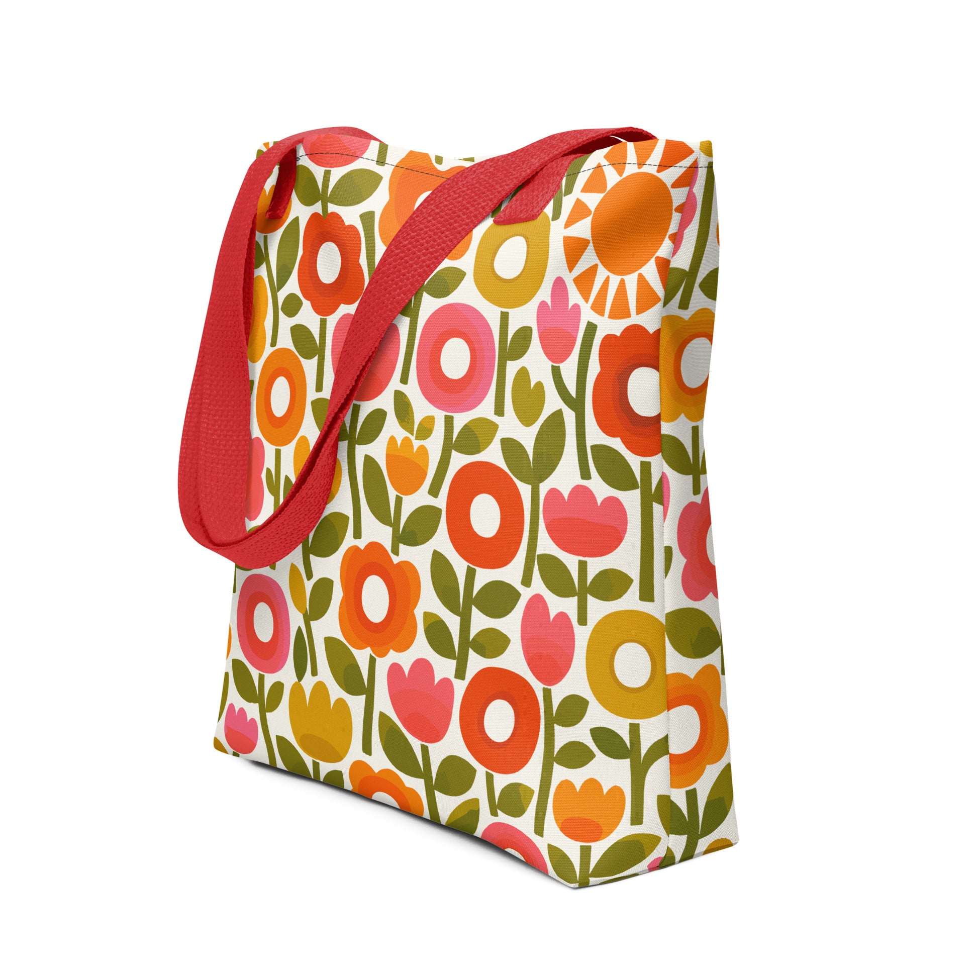 Retro 1970s flower power pattern tote bag featuring geometric orange, pink, and yellow flowers with green leaves