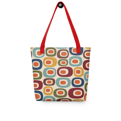 Retro 1970s mid-century modern geometric oval pattern tote bag printed with colorful mustard, orange, teal, and navy shapes