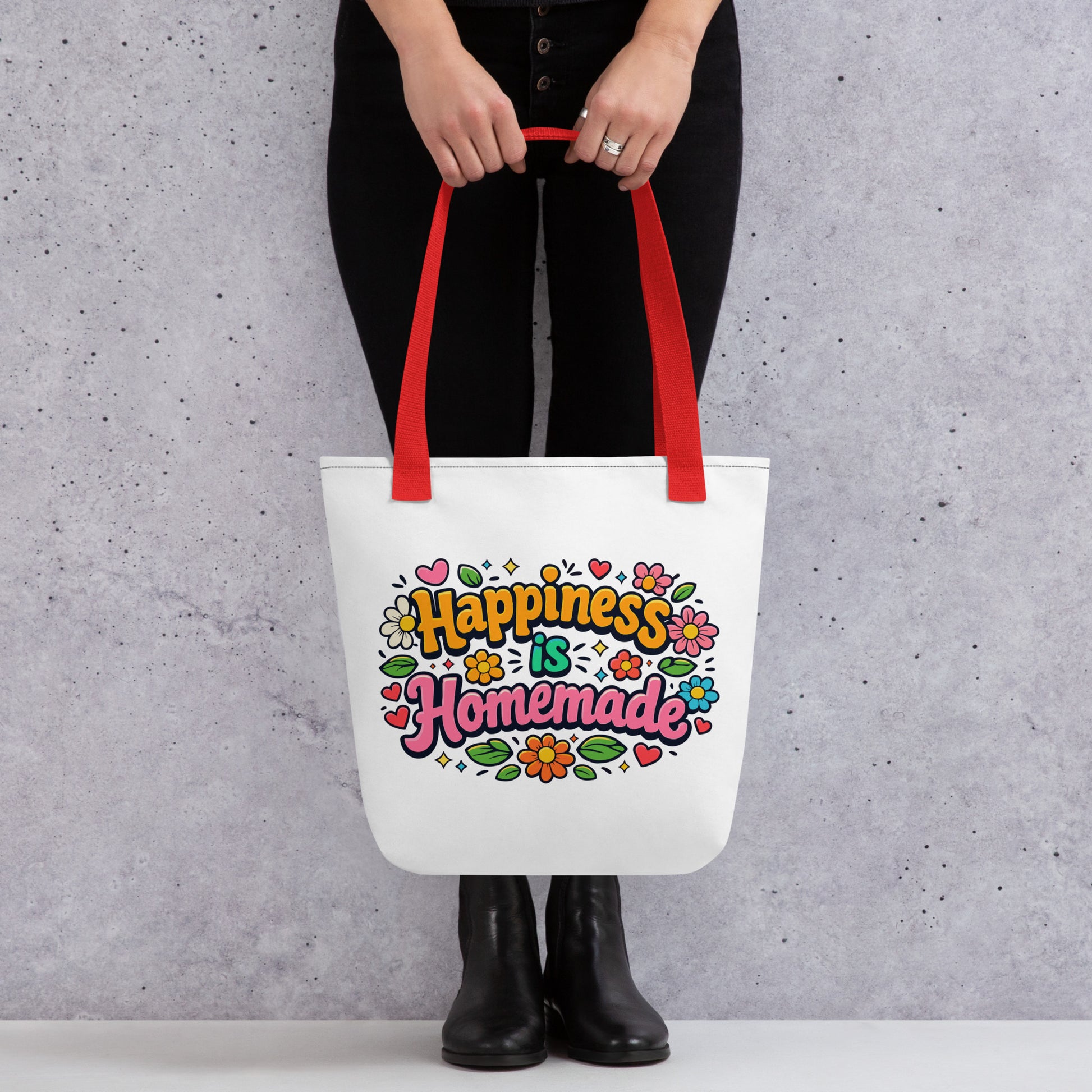 Retro tote bag featuring 'Happiness is Homemade' text with 1970s style flowers and hearts on a black background.