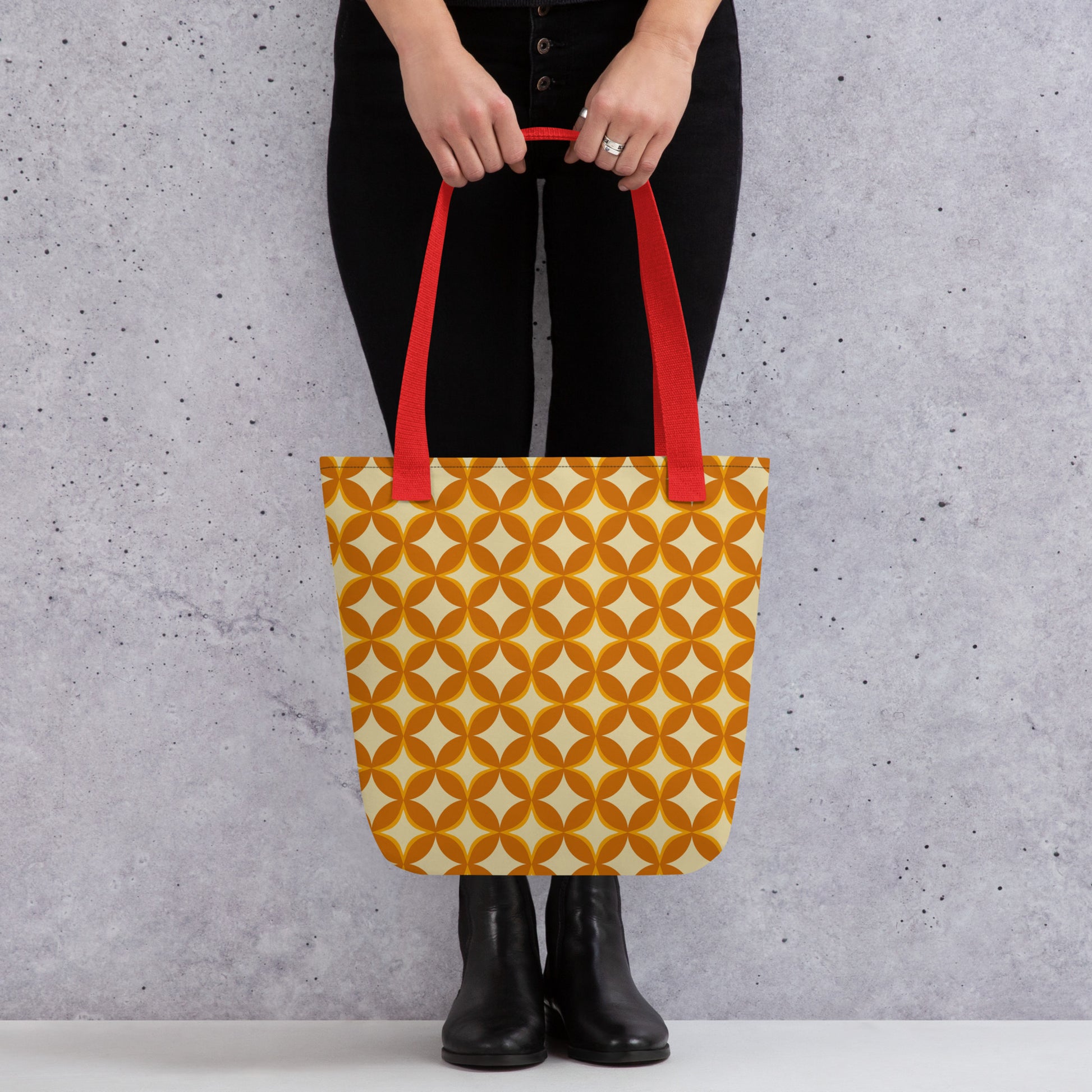 Repeating geometric pattern of interlocking orange and cream circles and stars in a 1970s retro vintage style.