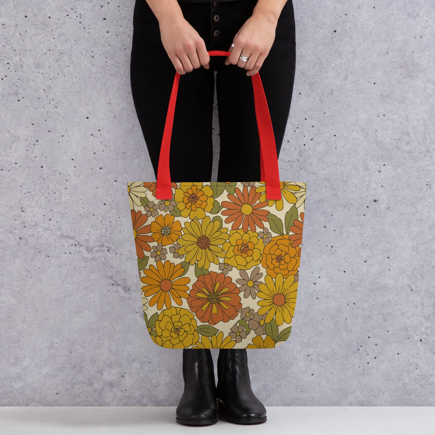 All-over retro floral pattern tote bag in warm mustard yellow, burnt orange, and green flower power design.