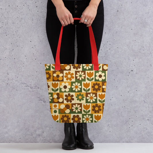 Polyester tote bag featuring a 70s retro floral tile pattern in orange, brown, and green from Far Out Goods.