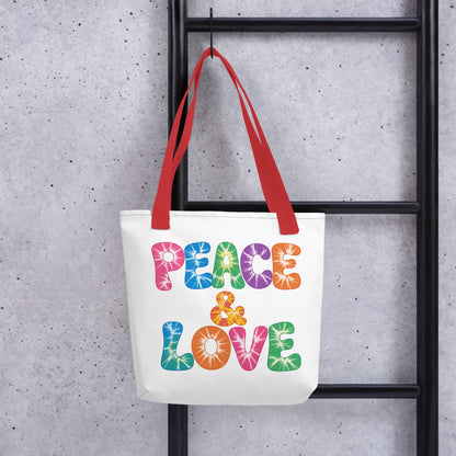 Retro tie-dye Peace and Love lettering printed on a reusable black polyester tote bag with vibrant 60s rainbow font.