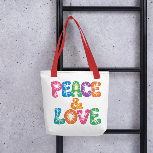Retro tie-dye Peace and Love lettering printed on a reusable black polyester tote bag with vibrant 60s rainbow font.