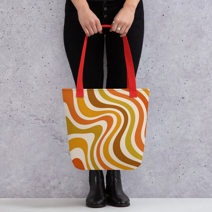 Retro 70s groovy wavy pattern in orange, mustard, brown, and cream printed on a durable polyester shoulder tote bag.