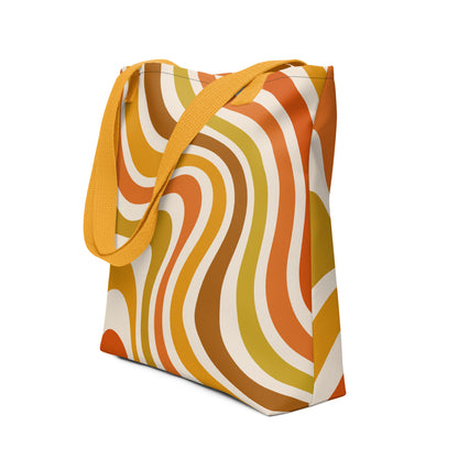 Retro 70s groovy wavy pattern in orange, mustard, brown, and cream printed on a durable polyester shoulder tote bag.
