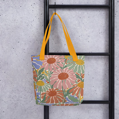 tote bag featuring a retro 70s floral pattern in pink, green, and blue by Far Out Goods