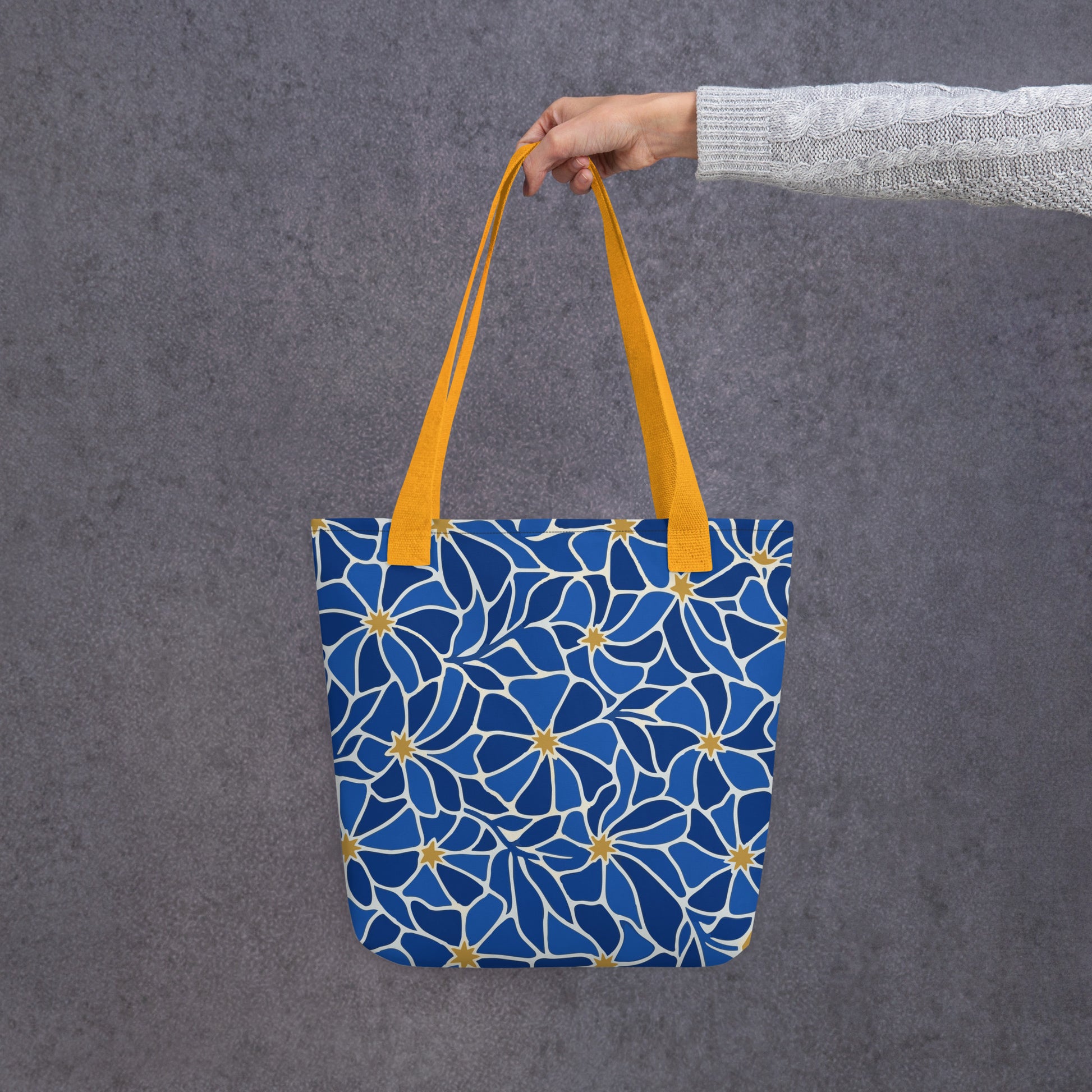 Mosaic pattern tote bag with vibrant blue flowers and gold star centers in a modern boho style by Far Out Goods