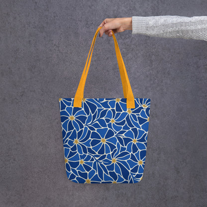 Mosaic pattern tote bag with vibrant blue flowers and gold star centers in a modern boho style by Far Out Goods
